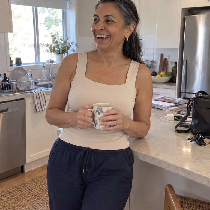 Smiling woman wearing the Comfort Tank